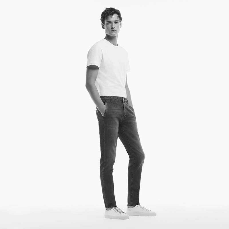 Smart style reigns as Jegor Venned slips into a pair of Liu Jo Uomo's chino-fit denim.