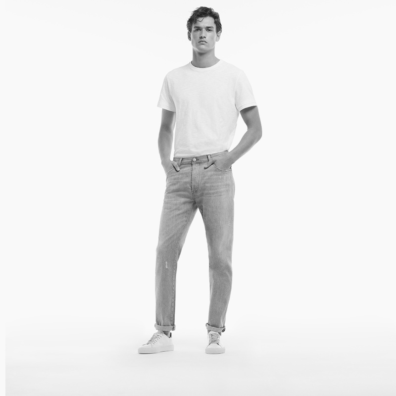 Stripped down to basic, essential style, Jegor Venned models a pair of Liu Jo Uomo's loose-fit jeans.