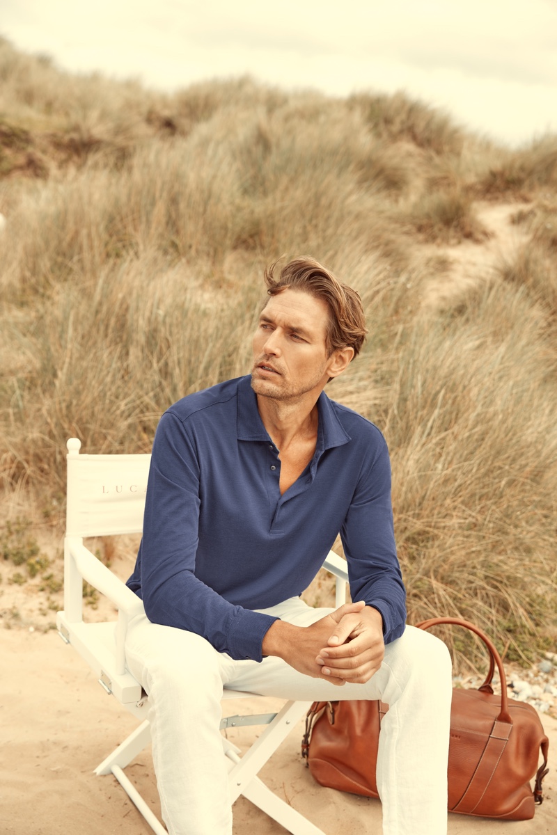 Robertas Aukstuolis sports an ocean blue silk-cotton polo shirt from Luca Faloni for the brand's high summer 2020 campaign.