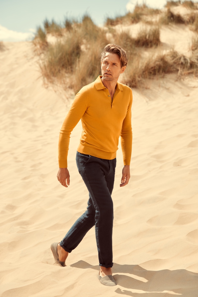 Luca Faloni enlists Robertas Aukstuolis as the star of its high summer 2020 campaign. He dons a chic mustard fine silk-cashmere polo.
