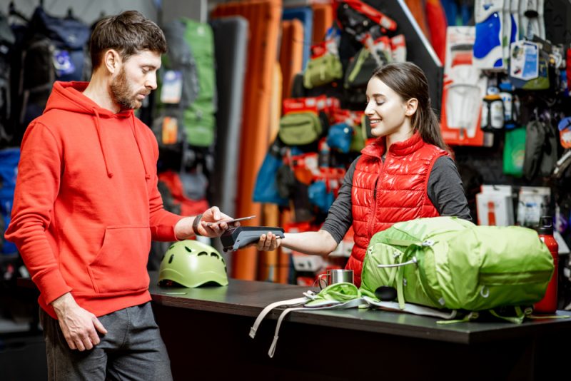 Man Checking Out at Store