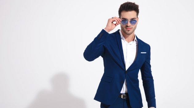 Sterling Style: What Clothing Color Goes with Silver Jewelry? Man in Blue Suit and Sunglasses and Rings