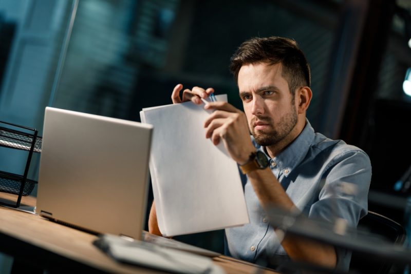 Man with Paperclipped Papers