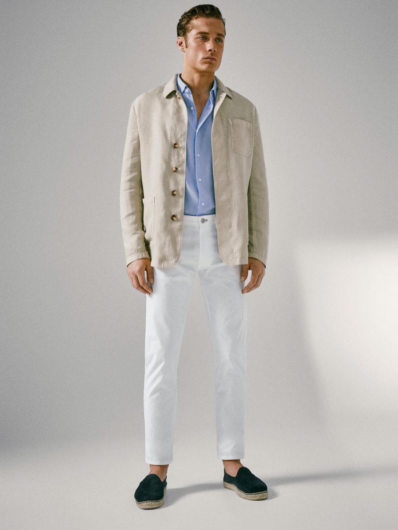 Steven Chevrin models a slim-fit dyed linen blazer with white jeans and a button-down shirt by Massimo Dutti.