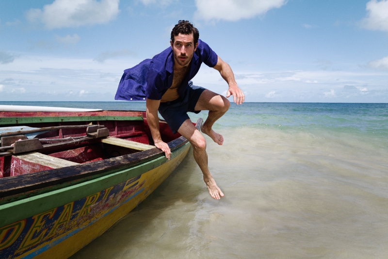 Justice Joslin stars in Orlebar Brown's 007 Heritage collection campaign. He sports a Thunderball blueprint capri collar linen shirt.