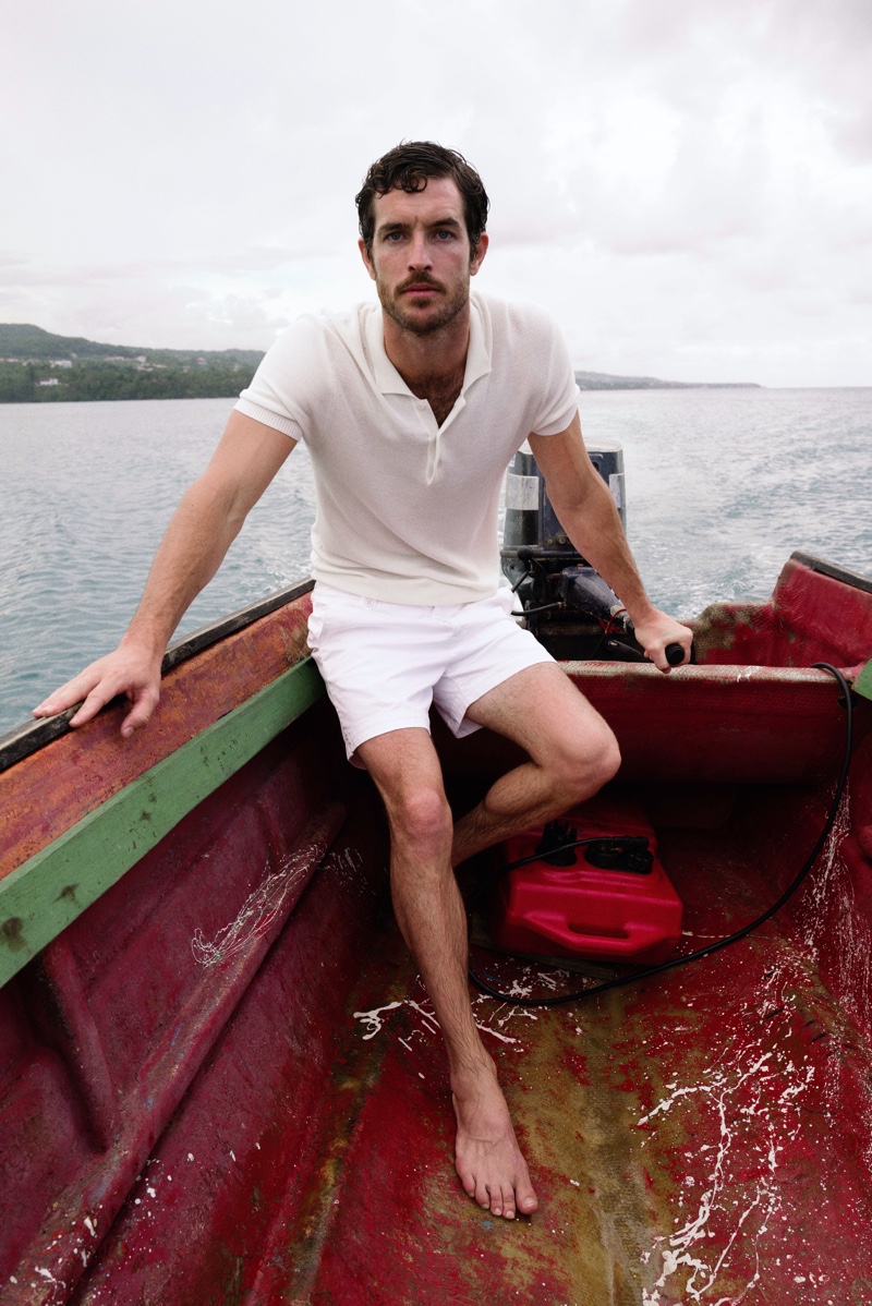 Model Justin Joslin dons Orlebar Brown's Dr. No knitted polo from its 007 Heritage collection.