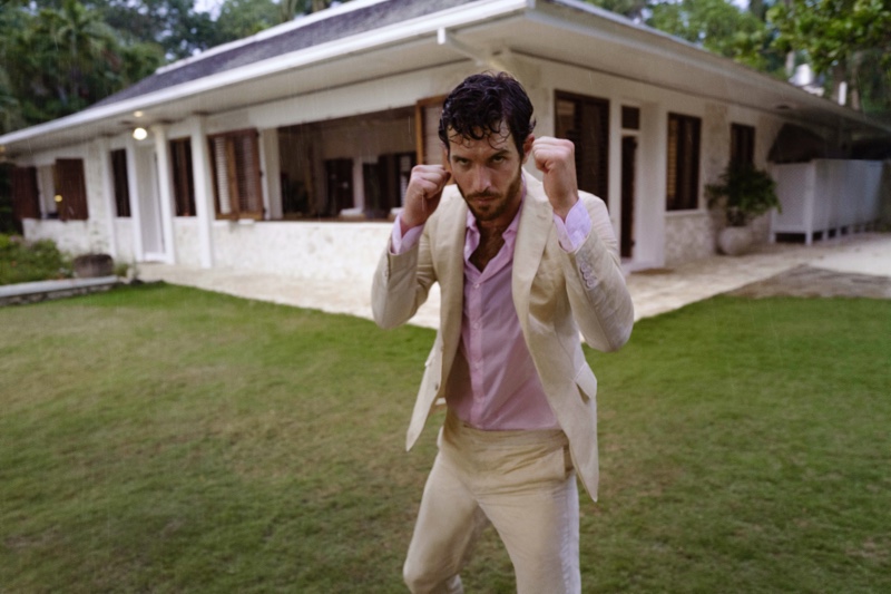 Taking a fighting stance, Justice Joslin sports a Bond linen jacket and trousers from Orlebar Brown's 007 Heritage collection.