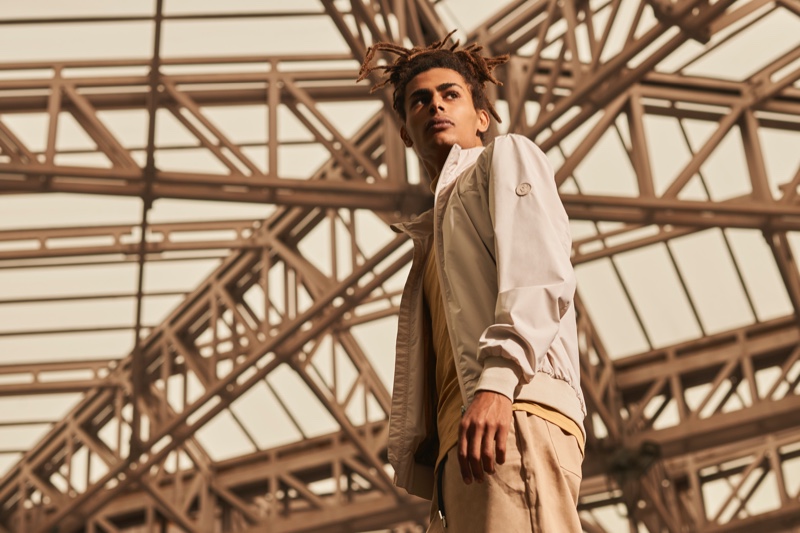 Posing against an urban setting, model Mohamed Ben Salem sports a jacket from Save The Duck.