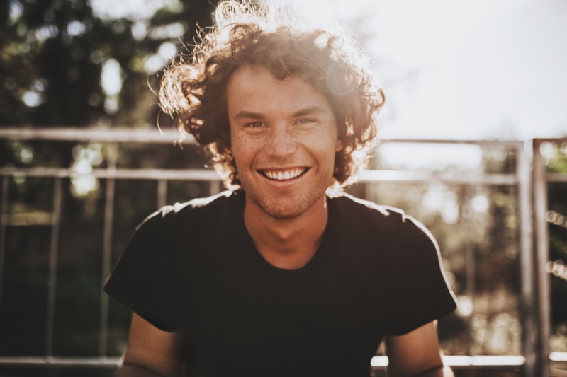 Smiling Man Curly Hair