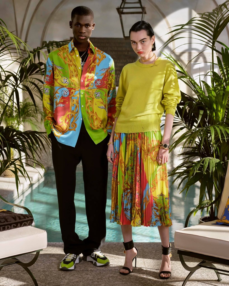 Making a colorful statement, Ismael Savane models Versace's Barocco Acanthus print silk shirt.