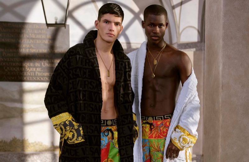 Versace Launches Summer Capsule Collection Models Islam Dulatov and Ismael Savane sport custom robes with swimwear from Versace's summer capsule collection.