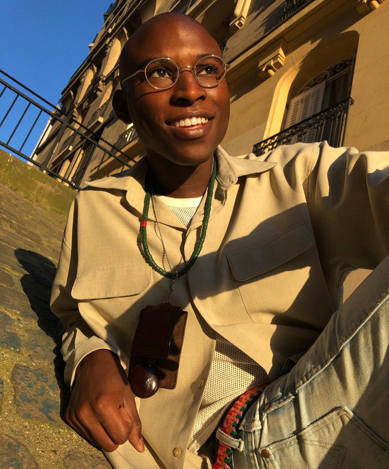 All smiles, Jibril Durimel wears Warby Parker's Simon glasses in brushed ink.
