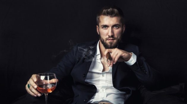 Here's How Cigarette Smoke Damages Clothing and Surfaces Attractive Man Smoking Cigar Glass Wine
