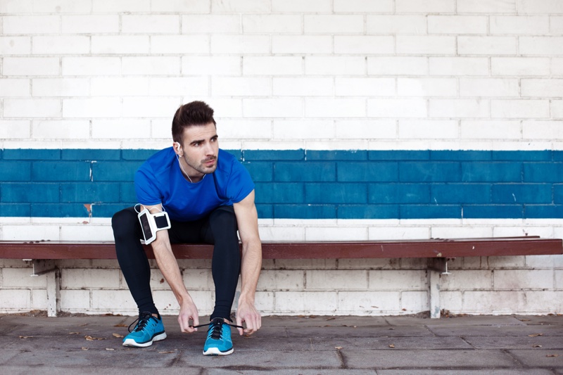 Attractive Man Tying Blue Sneakers Athlete Workout