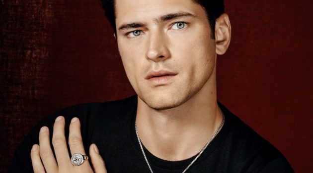 A Magical Memoir: Holt Renfrew Spotlights David Yurman Front and center, Sean O'Pry dons a David Yurman box chain silver necklace, Hamsa silver amulet, and skull silver amulet. He also sports a maritime anchor silver amulet and compass silver signet ring with a modern cable silver cuff bracelet. Layering for the Holt Renfrew shoot, Sean is pictured in David Yurman's maritime anchor leather wrap bracelet with silver and streamline silver link bracelet as well.