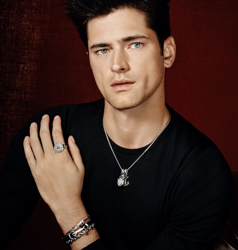 Front and center, Sean O'Pry dons a David Yurman box chain silver necklace, Hamsa silver amulet, and skull silver amulet. He also sports a maritime anchor silver amulet and compass silver signet ring with a modern cable silver cuff bracelet. Layering for the Holt Renfrew shoot, Sean is pictured in David Yurman's maritime anchor leather wrap bracelet with silver and streamline silver link bracelet as well.