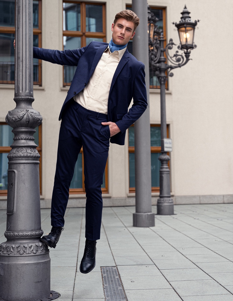 Linus wears suit Selected Homme, shirt Brachmann, and boots Gucci.