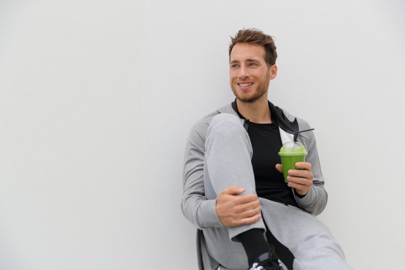 Man Drinking Smoothie in Workout Clothes
