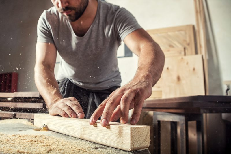 Man in Simple Attire Woodworking