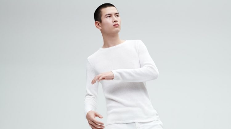A summer vision, Kohei Takabatake sports a sweater and pants from Marc O'Polo's white capsule collection.