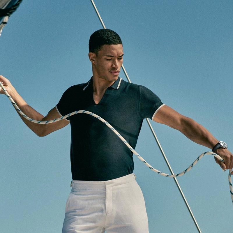 Raphael Balzer dons a navy tailored fit silk blend polo shirt from Orlebar Brown's IWC collection. » Orlebar Brown Embraces Nautical Aesthetic with IWC Capsule Raphael Balzer dons a navy tailored fit silk blend polo shirt from Orlebar Brown's IWC collection.