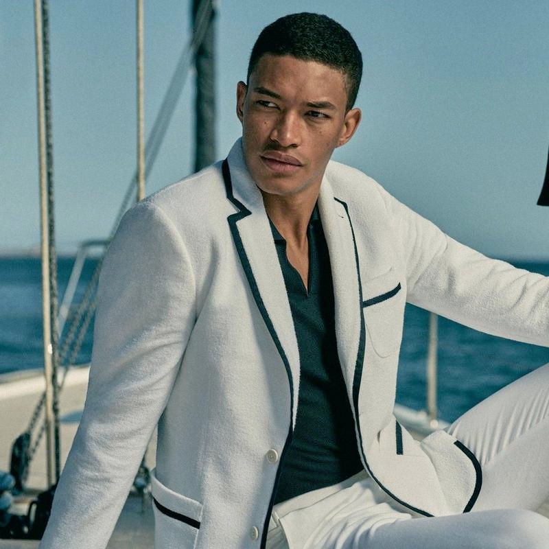 A chic vision, Raphael Balzer sports a white tailored fit toweling blazer with tailored fit trousers from Orlebar Brown's IWC collection. » Orlebar Brown Embraces Nautical Aesthetic with IWC Capsule A chic vision, Raphael Balzer sports a white tailored fit toweling blazer with tailored fit trousers from Orlebar Brown's IWC collection.
