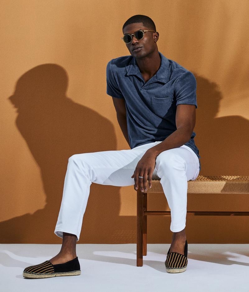 Making a case for adding a little texture to your wardrobe, Yahrock Bates models a terry Montauk polo in navy from Todd Snyder.