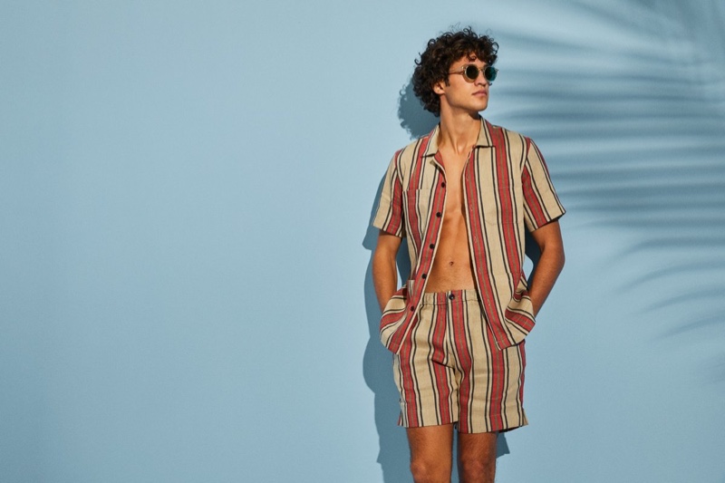 Francisco Henriques sports a red striped Bahama short-sleeve shirt with matching shorts from Todd Snyder.