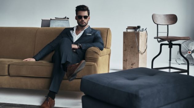 Modes by Aldo Carpinteri Is Here To Cater To Your Elite Fashion Needs Well Dressed Man Sitting Suit