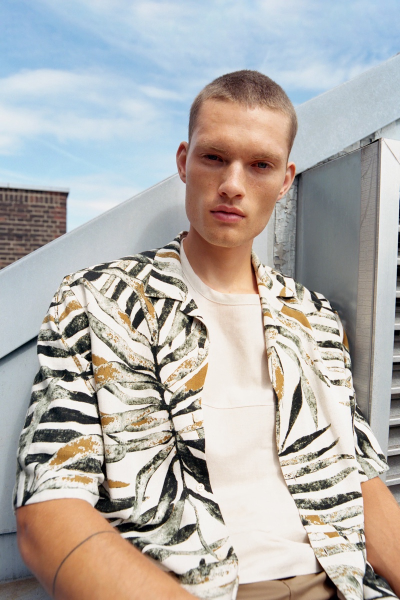 Channeling a tropical vibe, William Los sports a short-sleeve shirt from Zara.