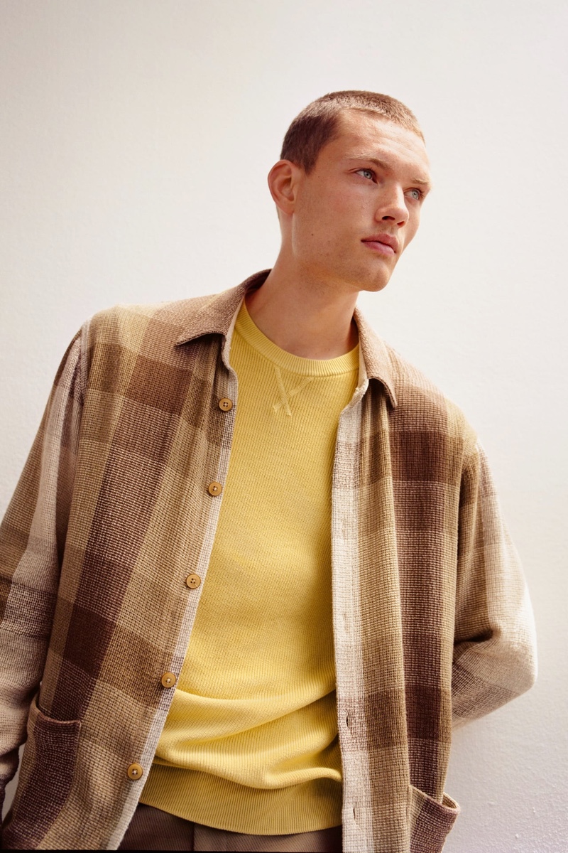 Front and center, William Los dons a textured plaid overshirt from Zara.