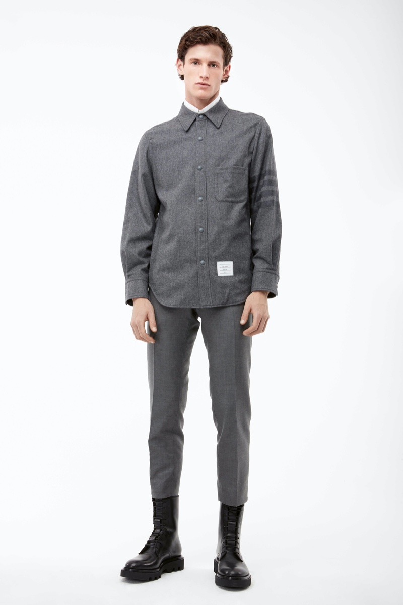 Connecting with APROPOS Journal for fall, Emil wears a gray look from Thom Browne.