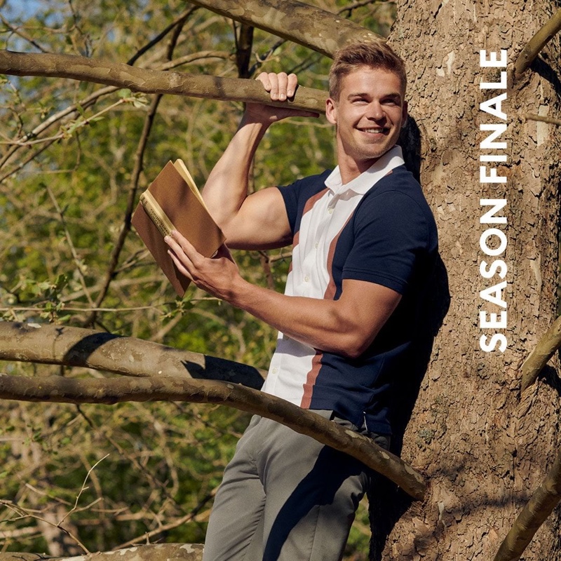 All smiles, Mitchell Slaggert dons a smart polo and chino pants from Banana Republic.