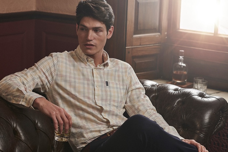 Sam Way models a smart plaid shirt from Barbour's fall-winter 2020 collection.
