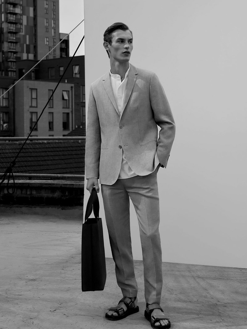 Front and center, Kit Butler dons a linen suit from COS.