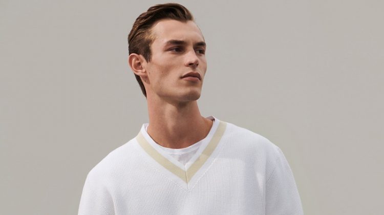 A smart vision in white, Kit Butler models a chic look from COS' 'To the Sea' collection.
