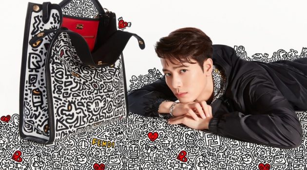 Fendi Celebrates Chinese Valentine's Day with Mr. Doodle Capsule Collection Posing next to a covetable Mr. Doodle bag, Jackson Wang fronts Fendi's latest campaign.