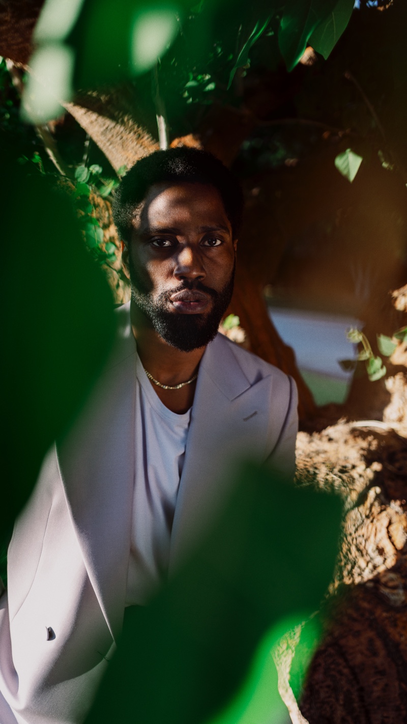 John David Washington dons a Maximilian Mogg tuxedo jacket with a Gabriela Hearst t-shirt and Bottega Veneta necklace for Mr Porter.