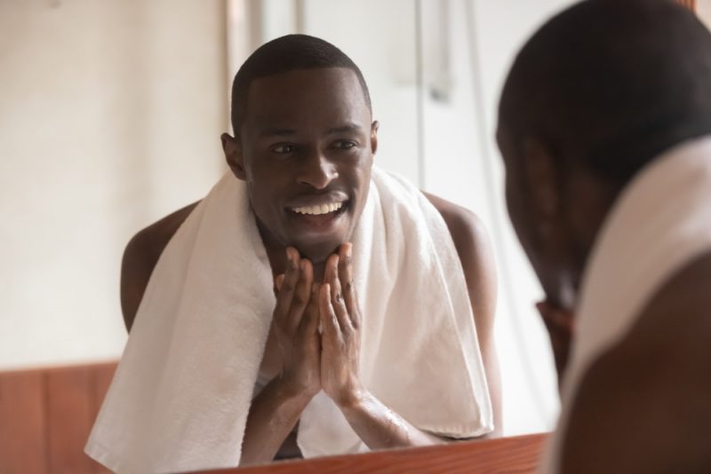 Man Smiling Washing Face Man Smiling Washing Face