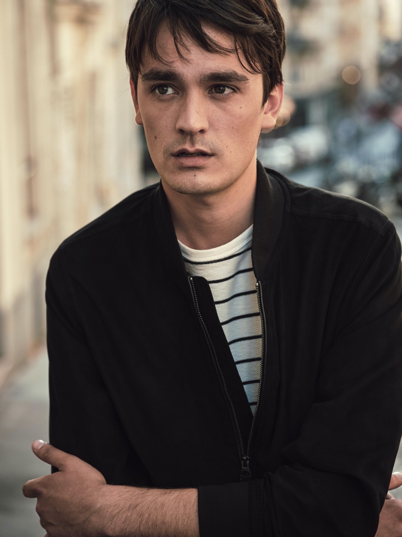 Connecting with Mango Man for fall-winter 2020, Alain-Fabien Delon wears a bomber jacket with a striped pullover.