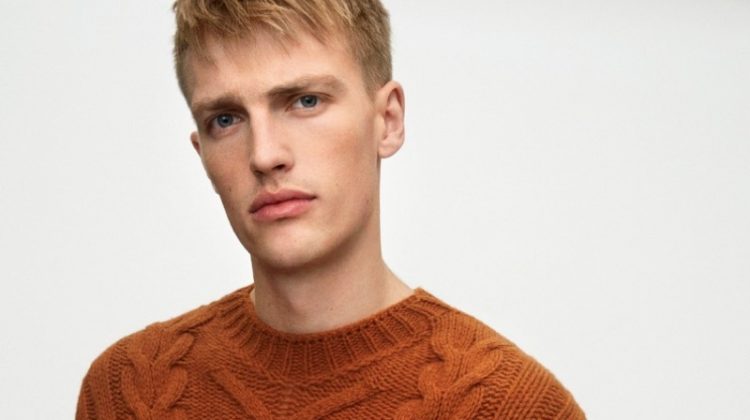 Victor Nylander dons a brown cable-knit sweater from Marc O'Polo's fall-winter 2020 casual collection.