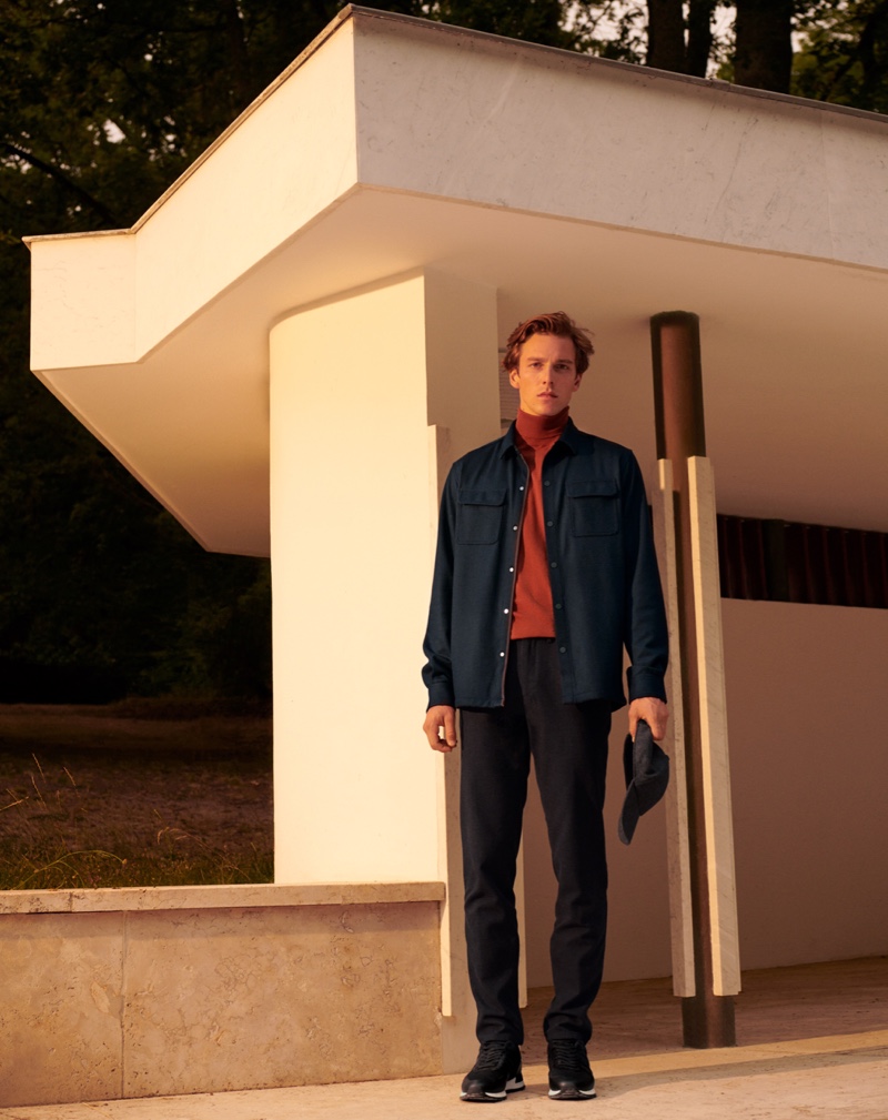 Standing tall, Quentin Demeester models a fall ensemble from Spanish brand Massimo Dutti.