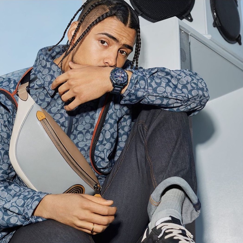 Rocking monogram style, Quincy Brown appears in Coach's C001 watch campaign.