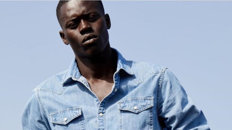 Doubling down on denim, Alpha Dia wears a look from Scotch & Soda's Amsterdams Blauw label.