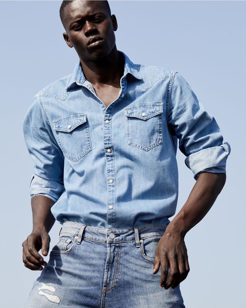 Doubling down on denim, Alpha Dia wears a look from Scotch & Soda's Amsterdams Blauw label.