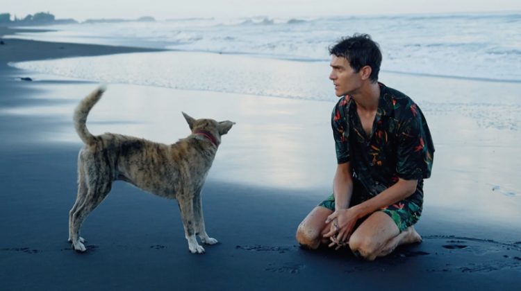 French model Vincent Lacrocq takes to the beach in a matching leaf print shirt and swim shorts by Zara.