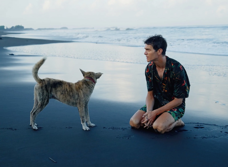 French model Vincent Lacrocq takes to the beach in a matching leaf print shirt and swim shorts by Zara.