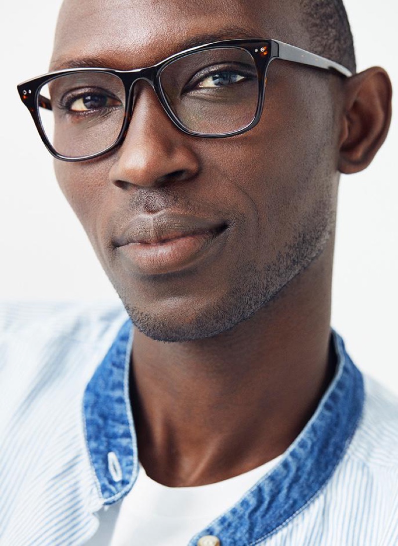 A smart vision, Armando Cabral models Warby Parker's Landon glasses in whiskey tortoise.