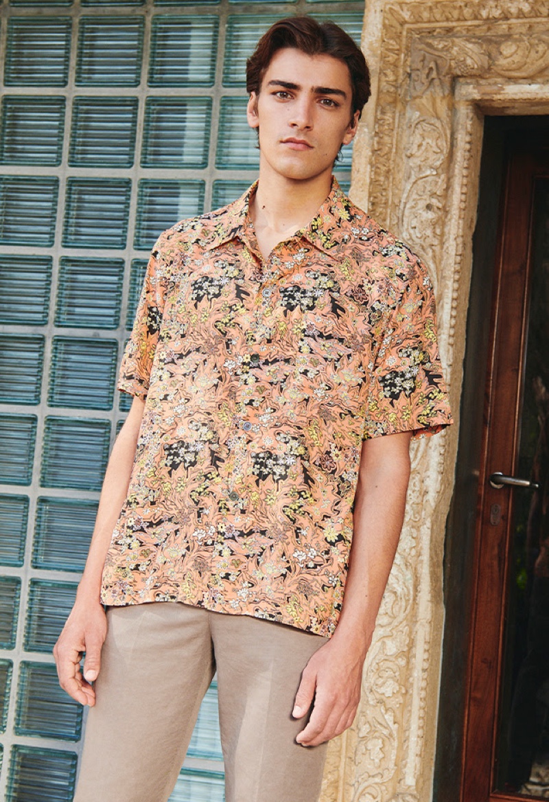 Michiel van Drongelen models a short-sleeve printed shirt with pleated linen pants from YOOX.