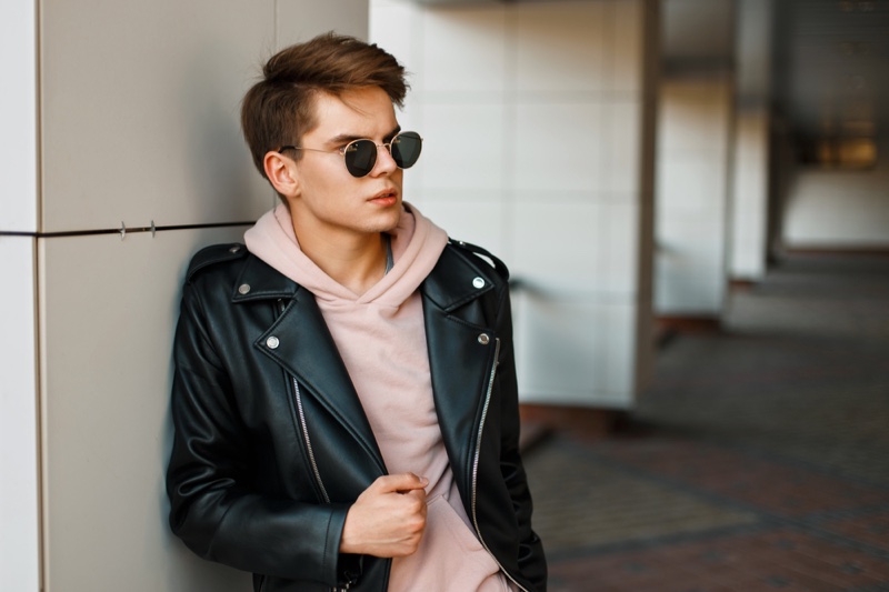 Young Man Leather Jacket Pink Hoodie Sunglasses